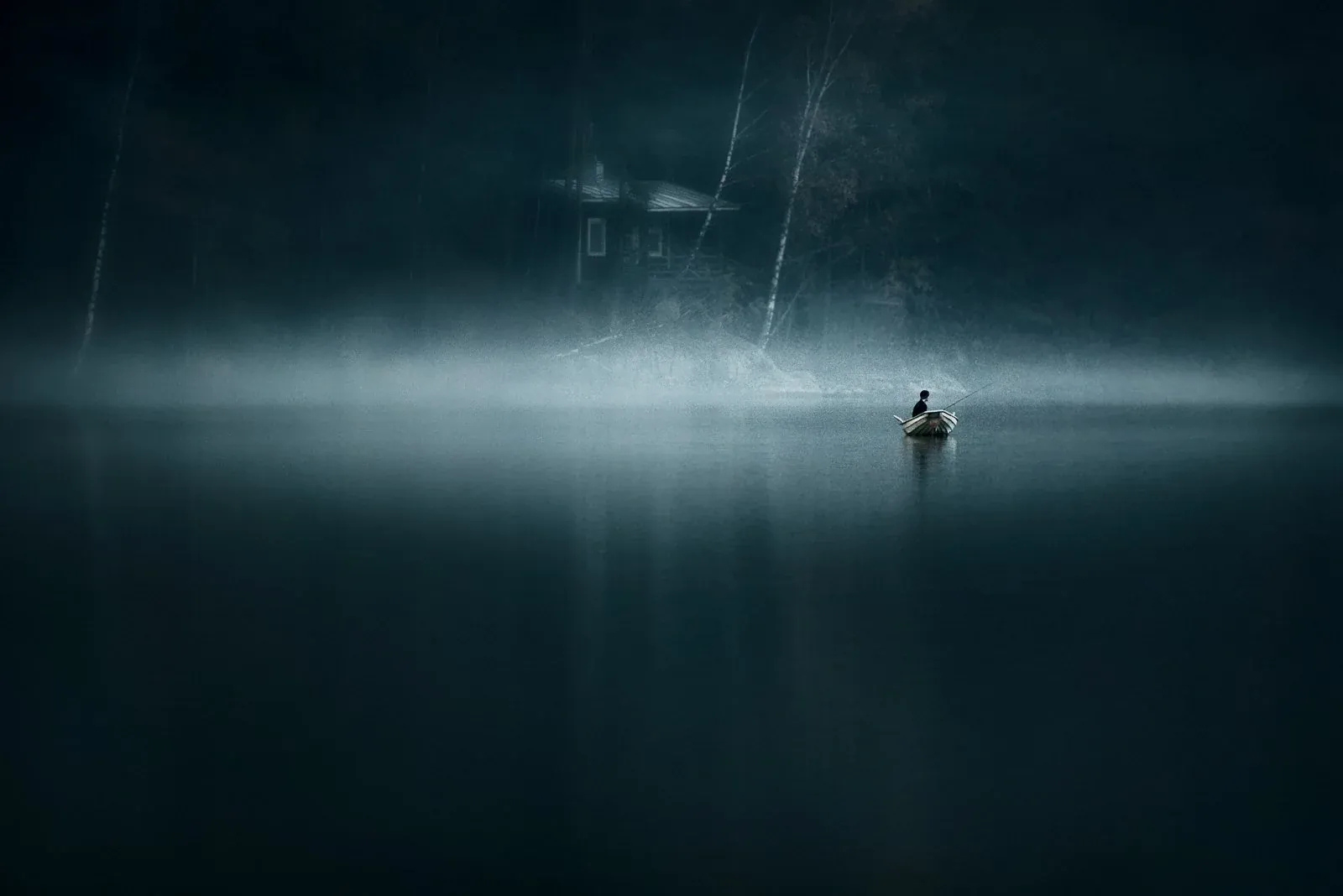 Solitary figure beneath a moonlit winter sky from the Alone collection by Mikko Lagerstedt