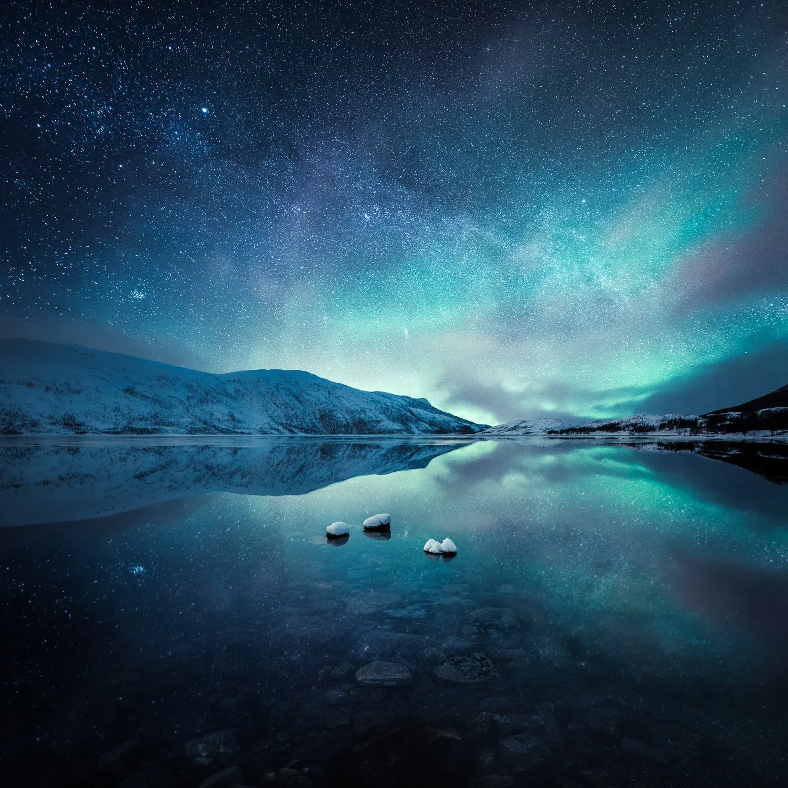 Milky Way and aurora over a northern landscape at night