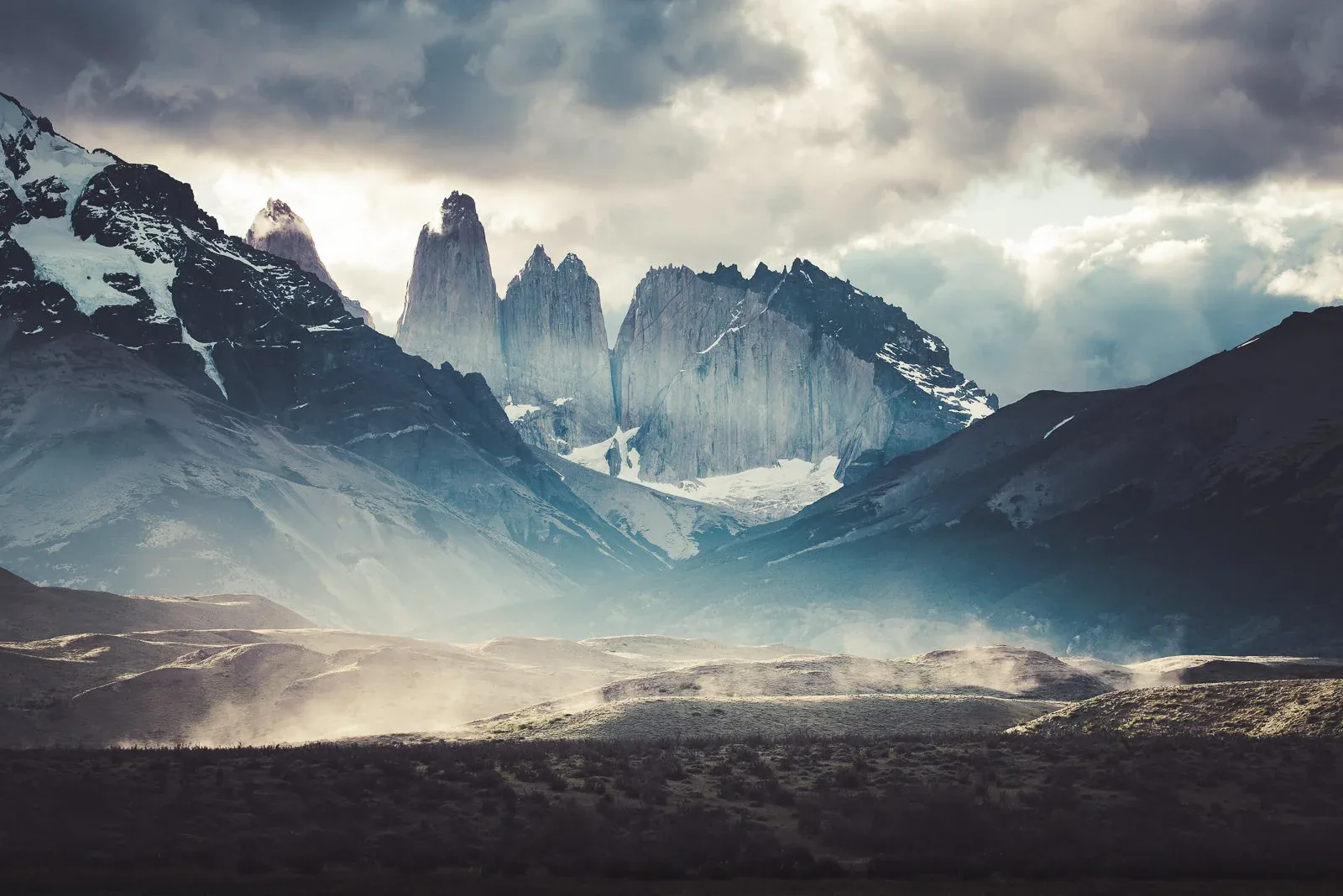 Milky Way above dark Patagonian mountains and water from the Patagonia collection by Mikko Lagerstedt