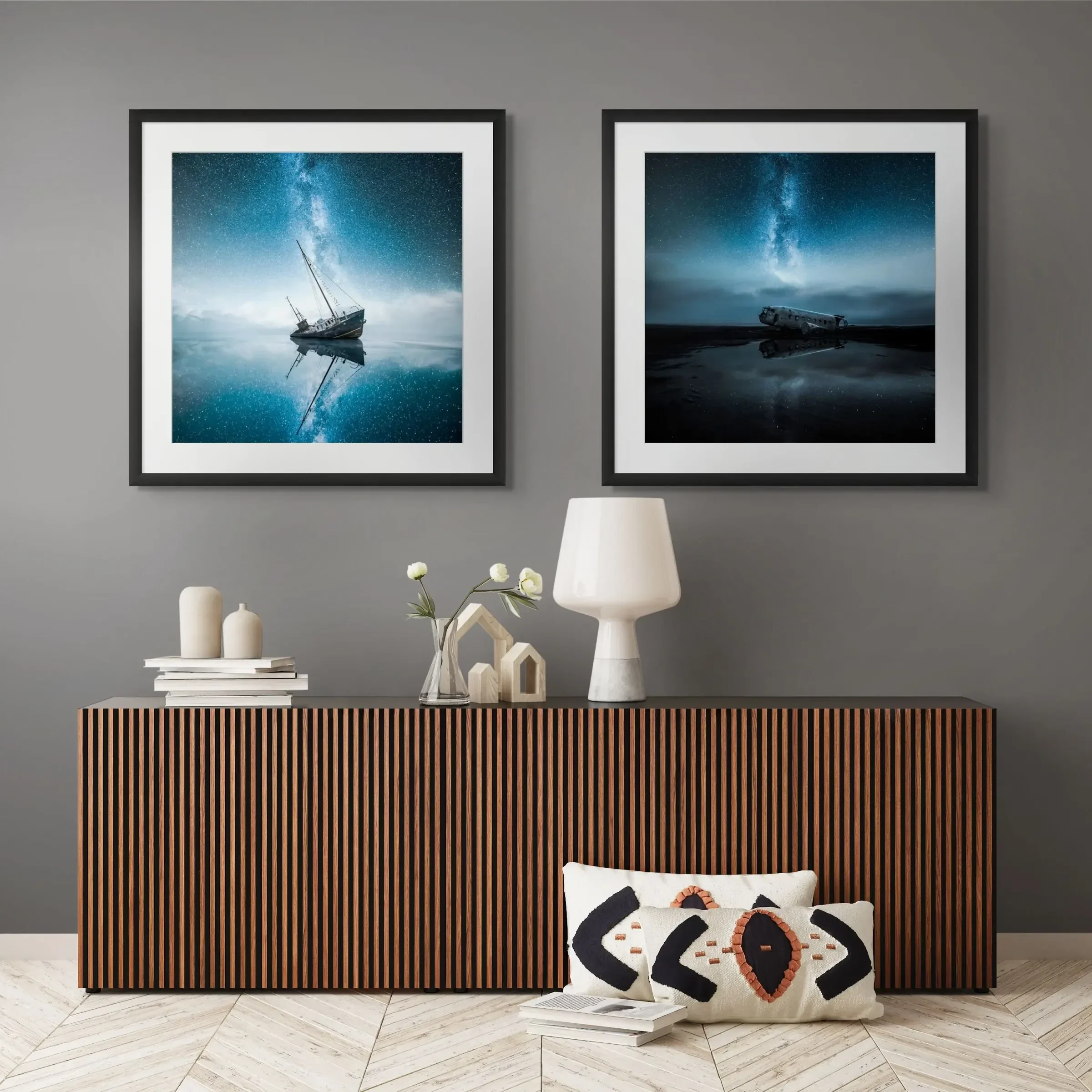 Two framed fine art prints above a sideboard
